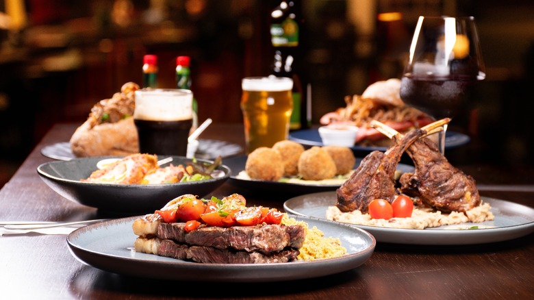 Table with steaks and beer