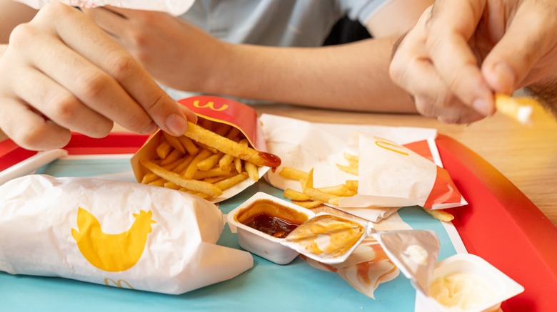 McDonald's tray with fries and dipping sauces