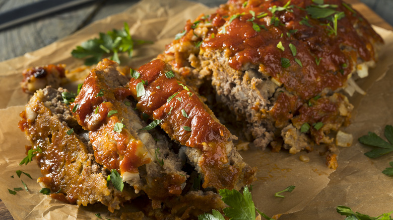 Sliced meatloaf on parchment paper
