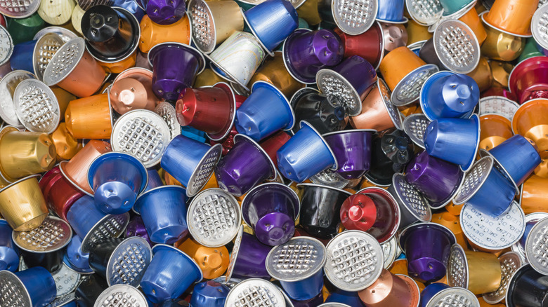 huge pile of used nespresso capsules