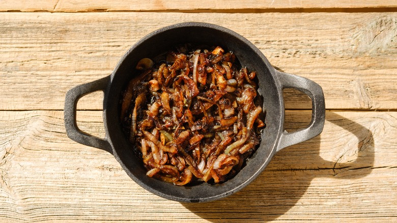 cast iron skillet with browned onions