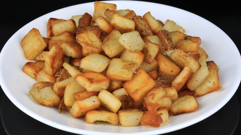 white plate of cubed potatoes