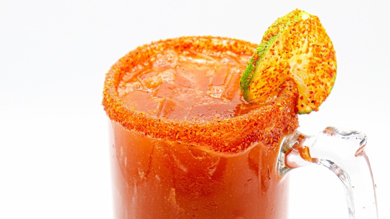 michelada with tajín and lime