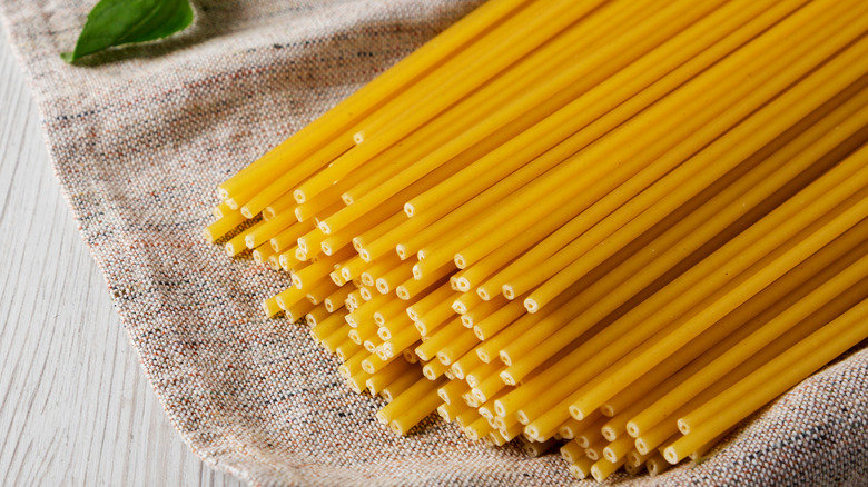 Dried bucatini pasta with basil