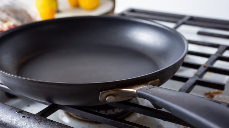 An empty nonstick pan is pictured on a stovetop.