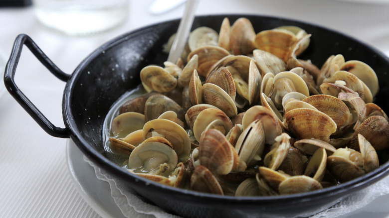 cooked clams in a metal bowl