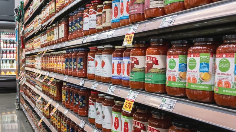 Jars of marinara sauce on store shelf