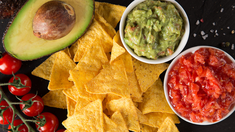 Tortilla chips with guacamole and salsa