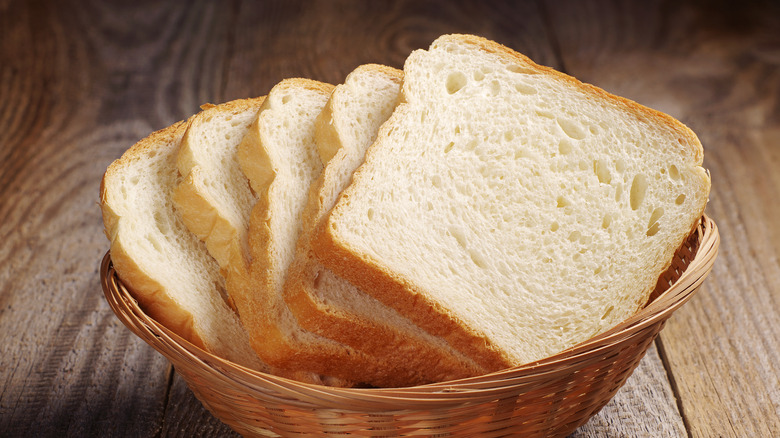 Slices of white bread arranged in a basket