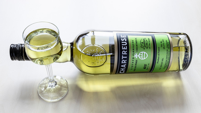 Different bottles of Chartreuse on a table