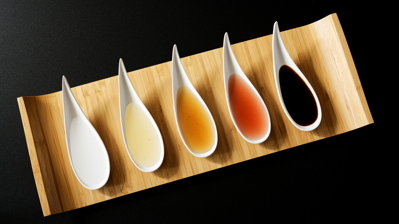 Different styles of vinegars on spoons