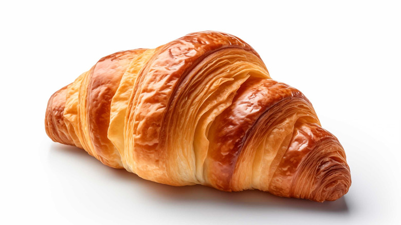 plain croissant on white background