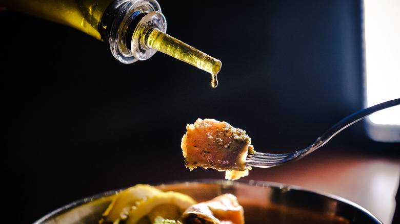 Oil being drizzled onto food
