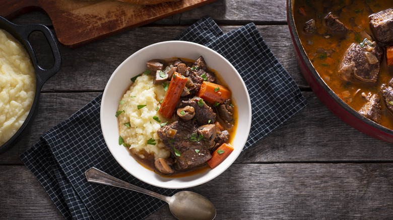 Bowl of beef bourguignon and potatoes