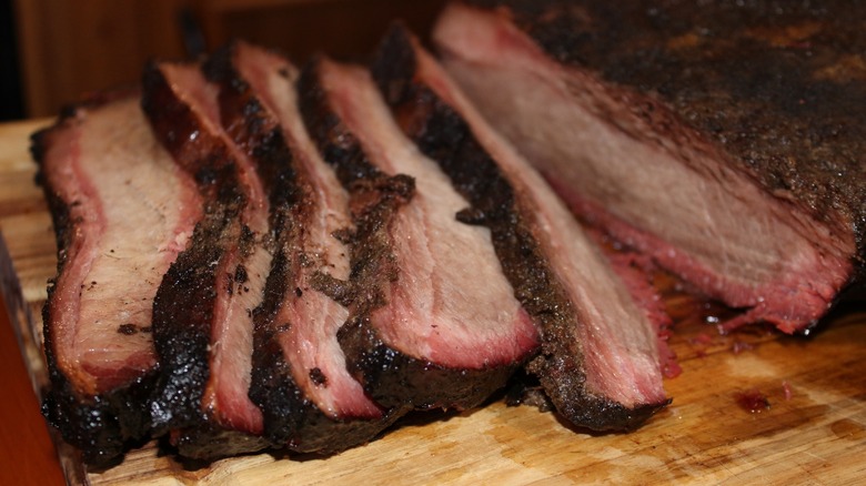 Sliced brisket on post oak