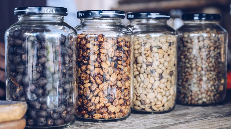 Glass jars filled with various dried beans