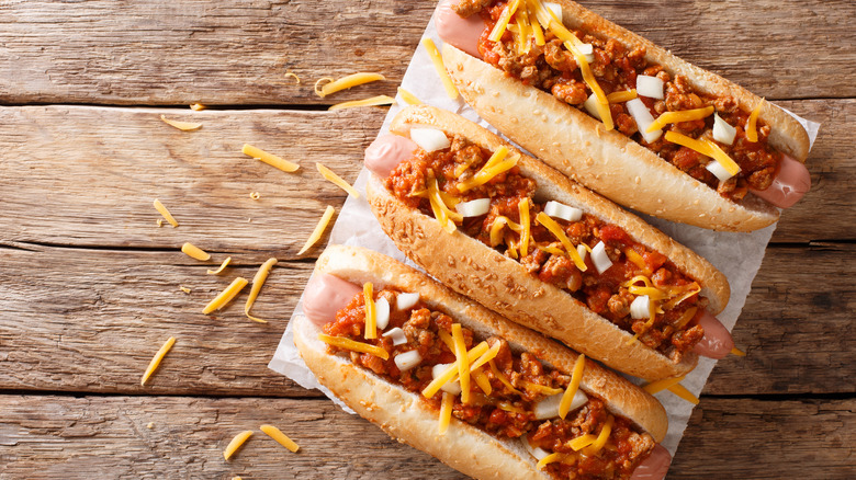 Chili dogs on wooden background