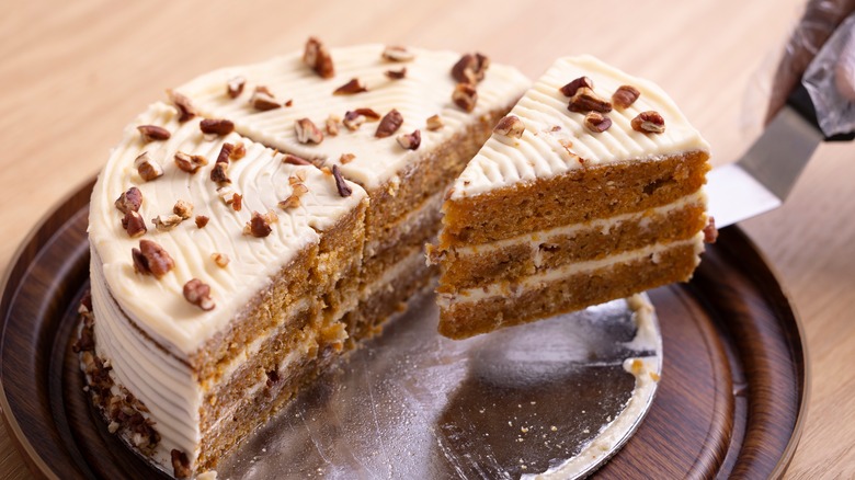 Carrot cake being sliced