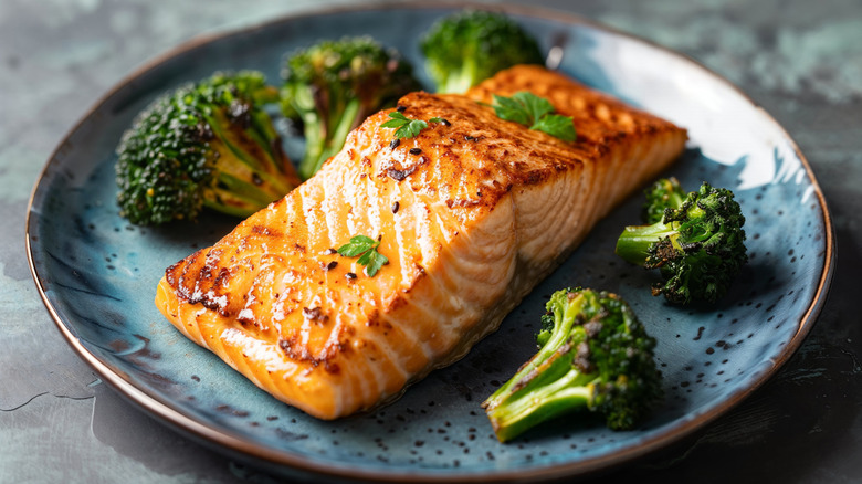 grilled salmon on plate with broccoli