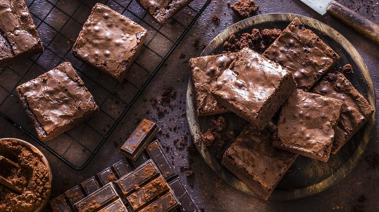 Sliced brownies and chocolate pieces