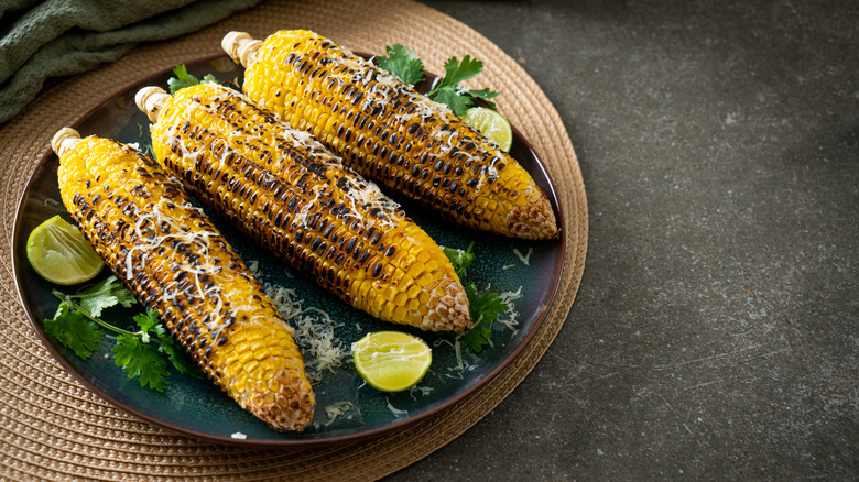 Grilled corn with cheese and lime