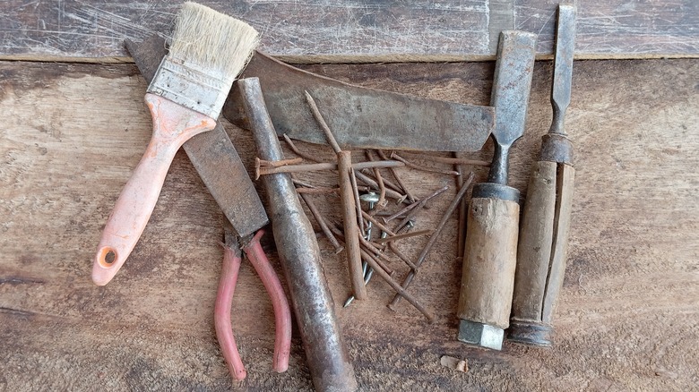 Old tools on wood background