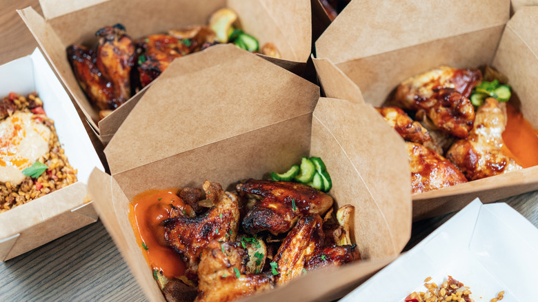 Brown takeout boxes with food