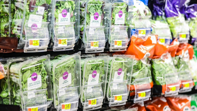 Packaged spinach on shelves
