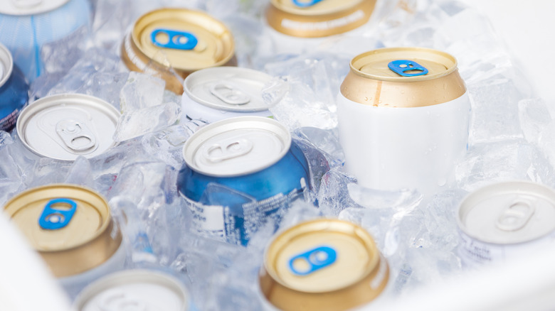 Canned drinks chilling in ice