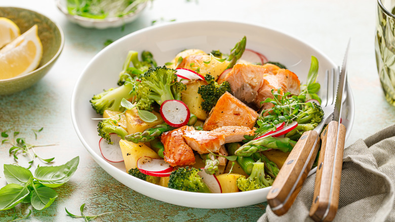 cold salmon and broccoli salad with silverware