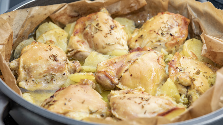 baked chicken thighs with potato slices