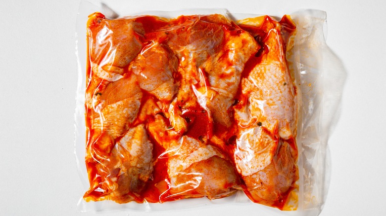 chicken pieces marinating in bag