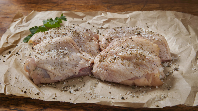 raw chicken thighs with seasonings