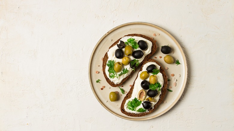 Bread with cream cheese and olives