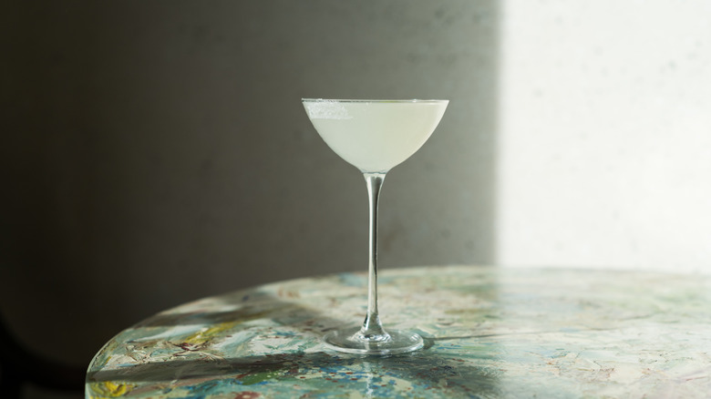 A lemon drop martini awaiting a garnish