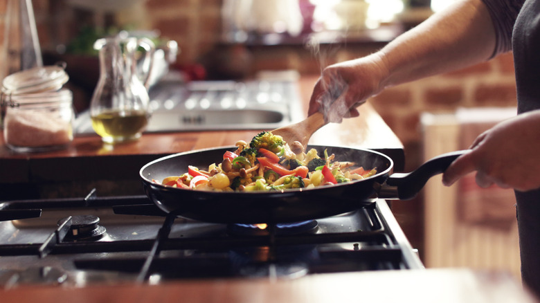 Person cooking stir fry
