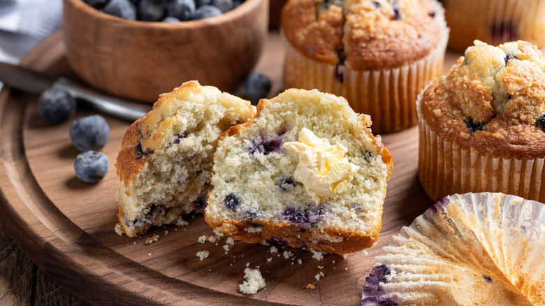 Sliced blueberry muffin with butter