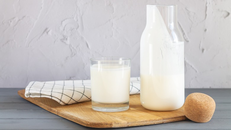 Jar and drinking glass with fermented milk