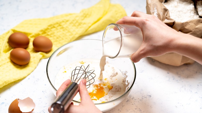 Mixing ingredients for pancake batter