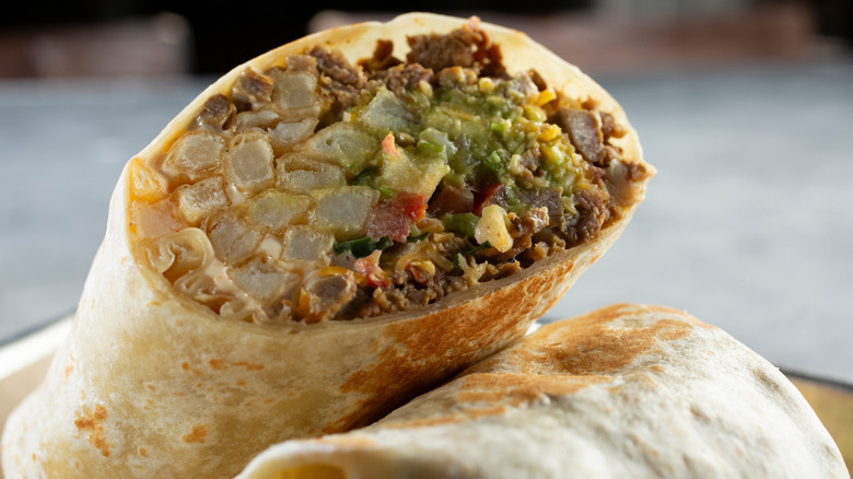 a cross-section of a packed California burrito