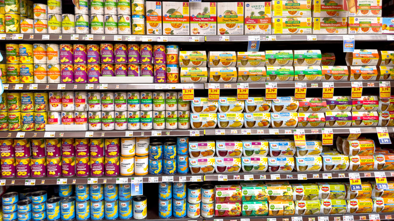 Varieties of canned fruit on grocery store shelves