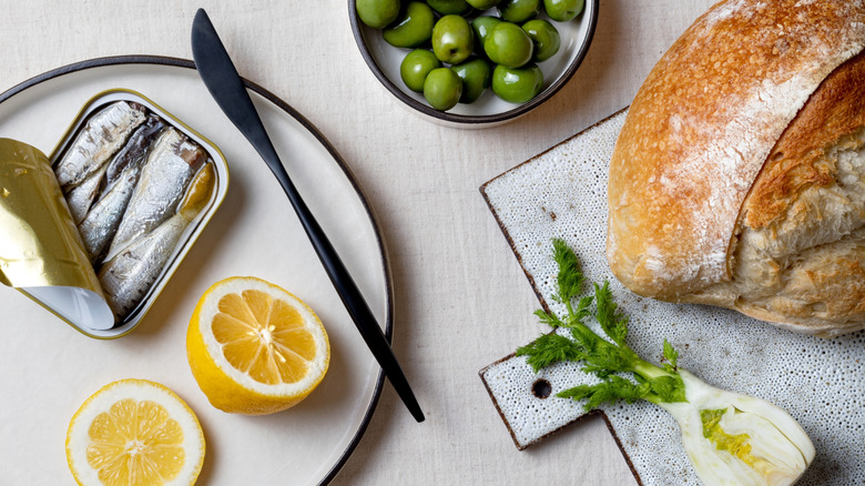 Tinned sardines with bread and olives