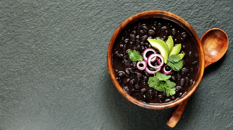 Black bean soup in a wooden bowl