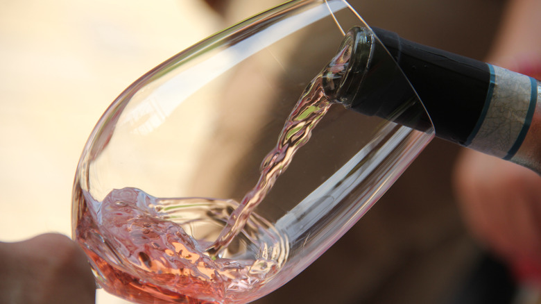 A wine glass with rosé