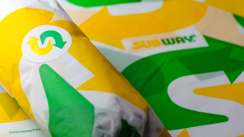 Subway brand paper wrapped around sandwich