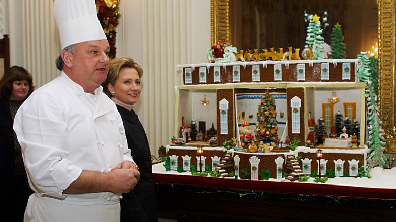 Pastry Chef Roland Mesnier, Hillary Clinton and one of Roland's gingerbread houses