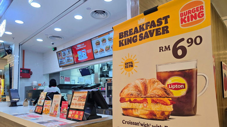 Interior of Burger King with breakfast advertisement