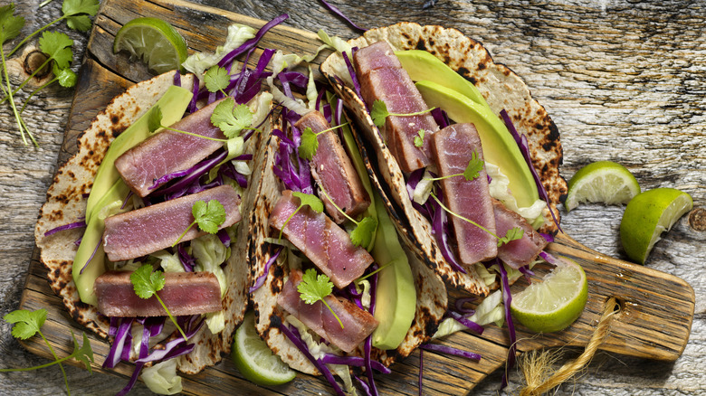 Seared ahi tuna tacos on a cutting board