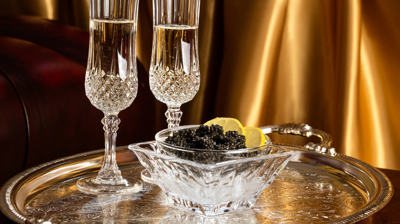 bowl of caviar with champagne
