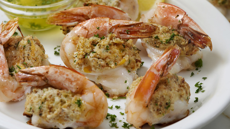 Butterflied stuffed shrimp on plate